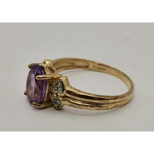 434A - Three 9 carat gold purple stone rings, the first claw-set with a cloudy oval stone to trifurcated op... 