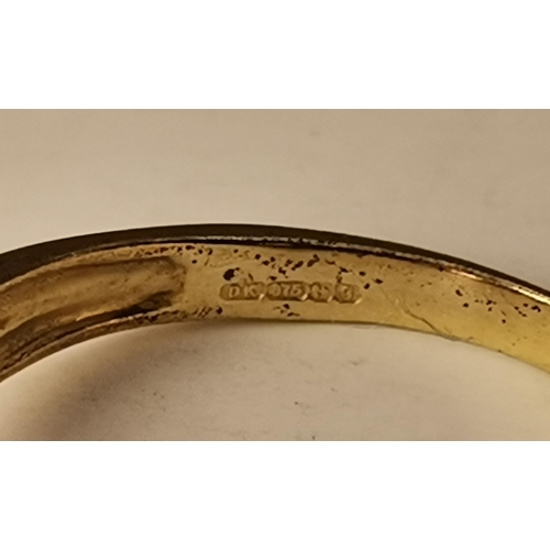 434A - Three 9 carat gold purple stone rings, the first claw-set with a cloudy oval stone to trifurcated op... 