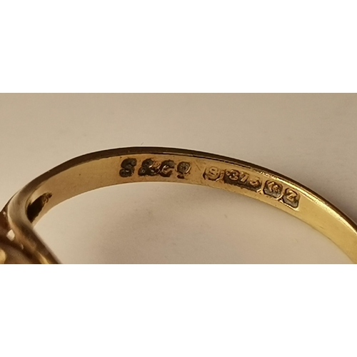 434A - Three 9 carat gold purple stone rings, the first claw-set with a cloudy oval stone to trifurcated op... 