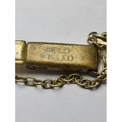 438 - A lady's 9 carat gold watch, the white circular dial signed Aoia 15 Jewels, with gilt Arabic numeral... 