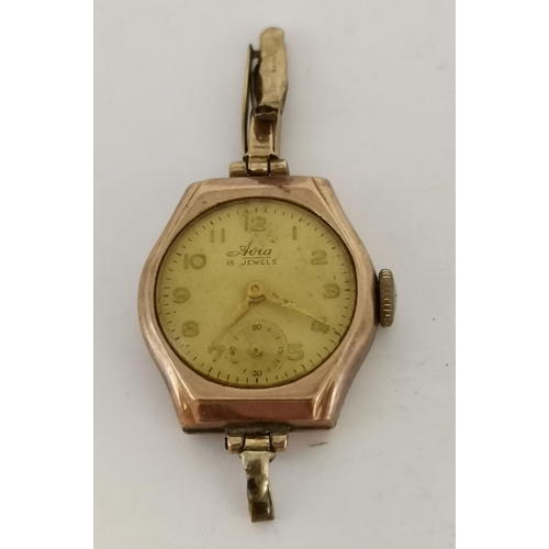 438 - A lady's 9 carat gold watch, the white circular dial signed Aoia 15 Jewels, with gilt Arabic numeral... 