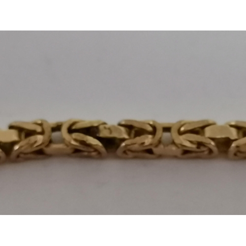 441 - A 9 carat gold byzantine chain, hallmarked Sheffield 375. 49cm long, 12.4g