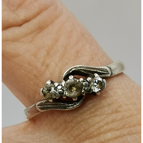 442A - Four 9 carat gold gem-set rings, variously set with white and blue stones, including three-stone cro... 