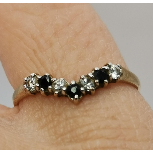 442A - Four 9 carat gold gem-set rings, variously set with white and blue stones, including three-stone cro... 