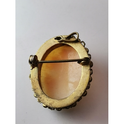 445A - An 18 carat gold citrine ring, the oval stone claw-mounted to trifurcated openwork shoulders in a ra... 