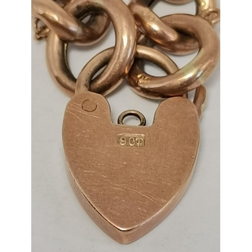 454A - A 9 carat rose gold curb bracelet with heart padlock clasp, all stamped 9C/9CT. 18cm long, 13.3g