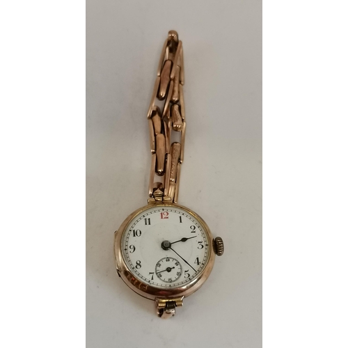 456 - A lady's 9 carat gold wristwatch, the white circular dial unsigned, with Arabic numerals, blued stee... 
