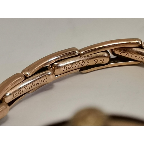 456 - A lady's 9 carat gold wristwatch, the white circular dial unsigned, with Arabic numerals, blued stee... 