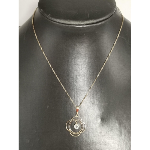 457 - An Art Nouveau style 9 carat gold pendant necklace on chain, the openwork quatrefoil pendant hung wi... 