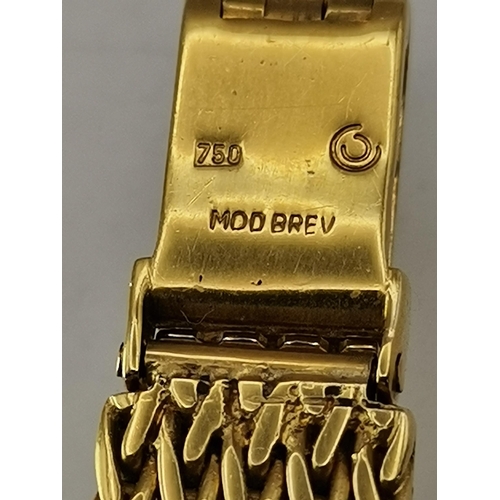 459 - A lady's 18 carat gold bracelet wristwatch, the silvered circular dial signed Certina, with blued st... 