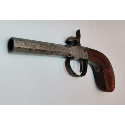 463 - A 19th Century percussion box lock pocket pistol, the octagonal barrel with stamped marks to left si... 