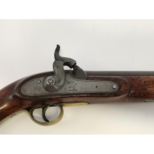 466 - East India Company: A late 18th/early 19th Century percussion service pistol, the walnut stock with ... 