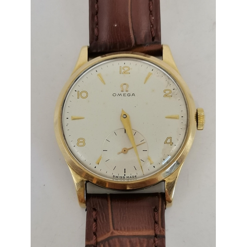 481 - A gent's 9 carat gold manual wind leather strap wristwatch, the ivory circular dial signed Omega, wi... 