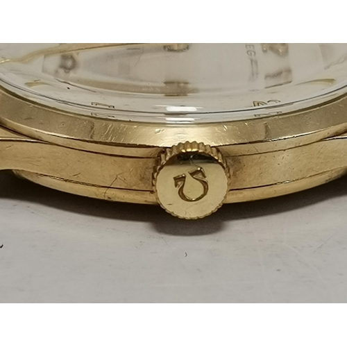 481 - A gent's 9 carat gold manual wind leather strap wristwatch, the ivory circular dial signed Omega, wi... 