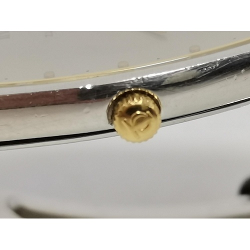 482 - A bi-metal quartz steel bracelet wristwatch, 1980s, the silvered cushion shaped dial signed Baume & ... 