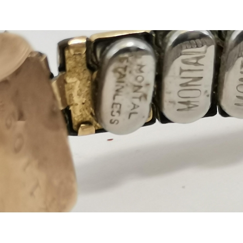 484 - A lady's Art Deco 9 carat gold wristwatch, the white oval dial with a gilded centre, black Arabic nu... 