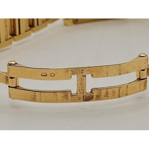 484a - Cartier: A lady's 18 carat gold Tank Française bracelet wristwatch, ref. 2385, the ivory dial signed... 