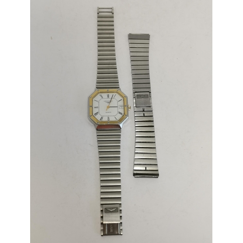 485 - A quartz steel and gilt metal bracelet watch, 1980s, the octagonal white dial signed Longines, ref. ... 