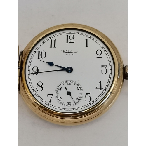 487 - A gold-plated Waltham USA Traveler full hunter pocket watch, the cream enamel dial signed, with blac... 