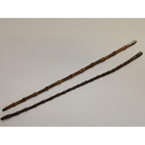 496 - Two First World War bamboo Royal Flying Corps swagger sticks, the white-metal caps each with RFC win... 