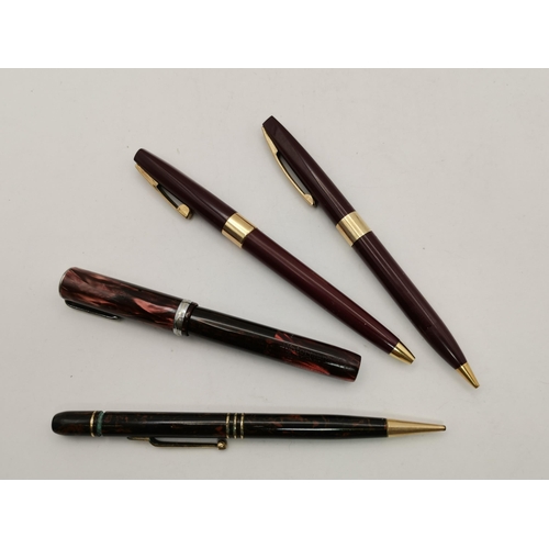 502 - A collection of assorted pens, comprising a Sheaffer ball point pen and propelling pencil set; an ea... 