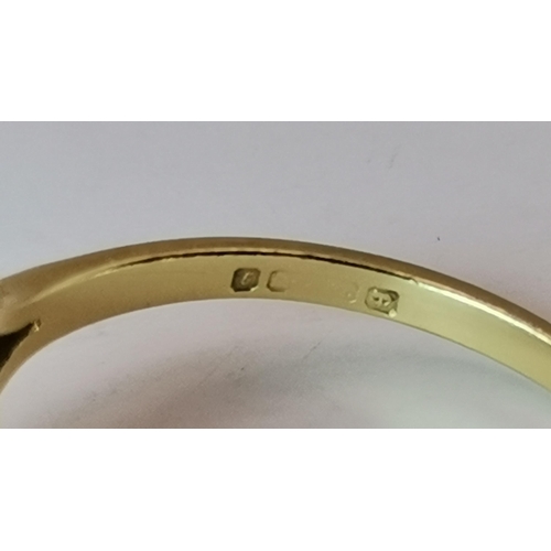 527A - An 18 carat gold blue and white stone cluster ring, the central oval stone enclosed by ten small rou... 