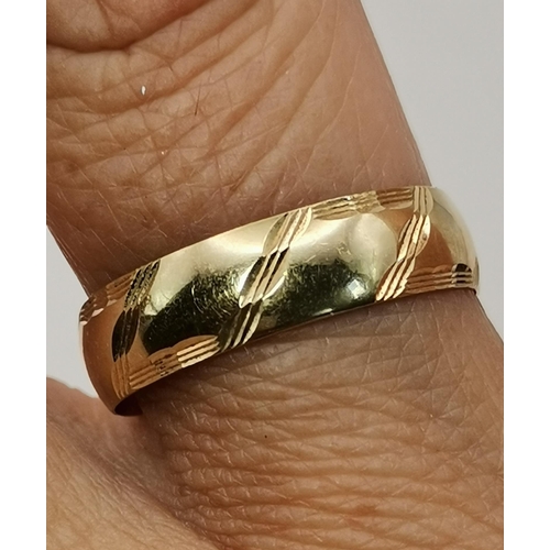 536A - Two 9 carat gold rings, the first a bulbous band with engraved diagonal decoration, ring size V; the... 