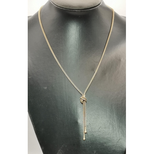 539A - A 9 carat gold foxtail chain lariat necklace, with knot detail, hallmarked and stamped 9CT. 50cm lon... 