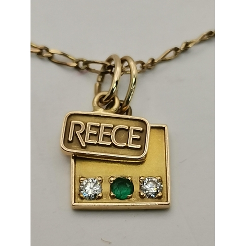 541 - A 9 carat gold fine fancy link chain necklace, hallmarked 375, hung with two 14 carat gold charms, o... 