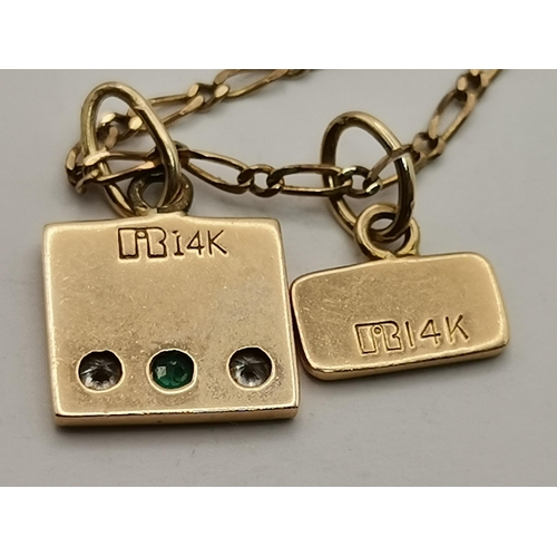 541 - A 9 carat gold fine fancy link chain necklace, hallmarked 375, hung with two 14 carat gold charms, o... 