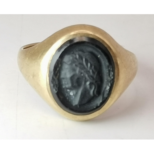 544 - A 9 carat gold signet ring, the oval black onyx matrix carved with a classical portrait, hallmarked ... 