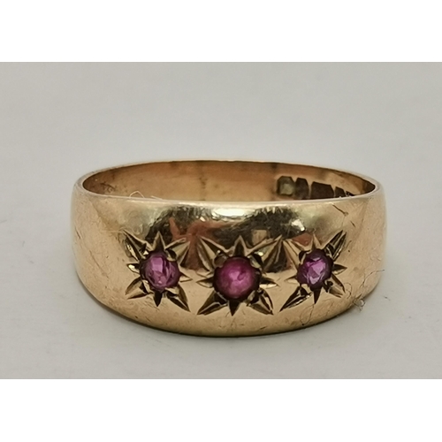 545 - A 9 carat gold and diamond buckle ring, with chased foliate and floral decoration, set with eight sm... 