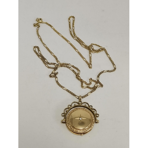 546 - A 9 carat gold swivel locket pendant to a fine Figaro chain; together with a 9 carat gold fouled anc... 