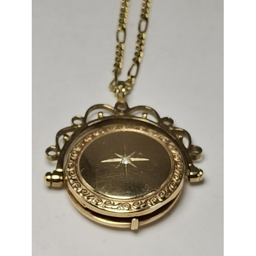 546 - A 9 carat gold swivel locket pendant to a fine Figaro chain; together with a 9 carat gold fouled anc... 