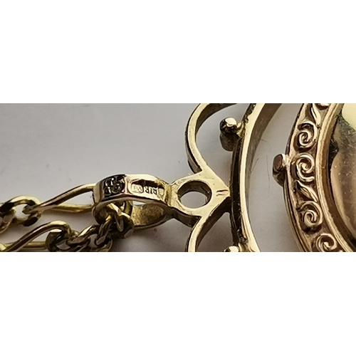 546 - A 9 carat gold swivel locket pendant to a fine Figaro chain; together with a 9 carat gold fouled anc... 