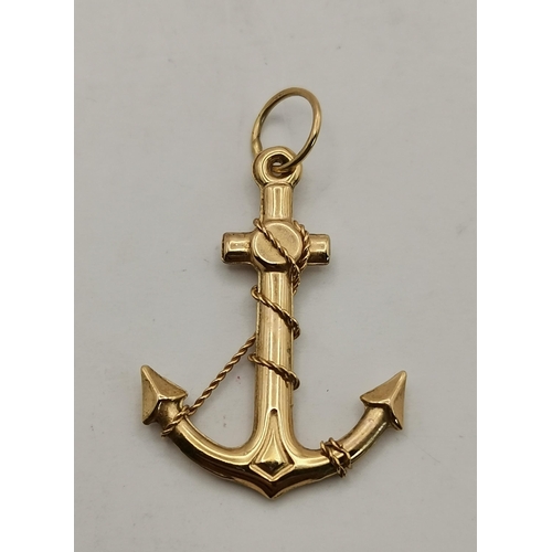 546 - A 9 carat gold swivel locket pendant to a fine Figaro chain; together with a 9 carat gold fouled anc... 