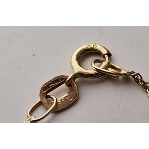 546 - A 9 carat gold swivel locket pendant to a fine Figaro chain; together with a 9 carat gold fouled anc... 