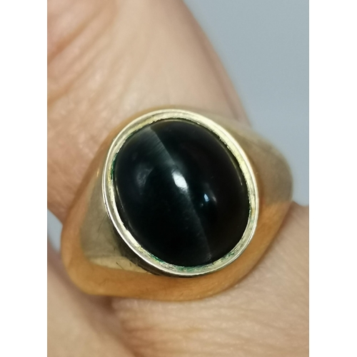 558A - A gent's 9 carat gold banded hardstone cabochon signet ring, hallmarked 375, ring size S; together w... 