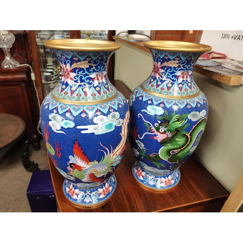 116 - A large pair of Chinese cloisonné vases, each decorated with a green five-toed dragon chasing a flam... 