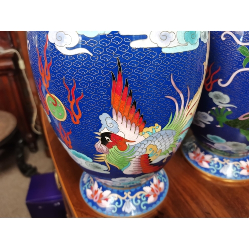 116 - A large pair of Chinese cloisonné vases, each decorated with a green five-toed dragon chasing a flam... 