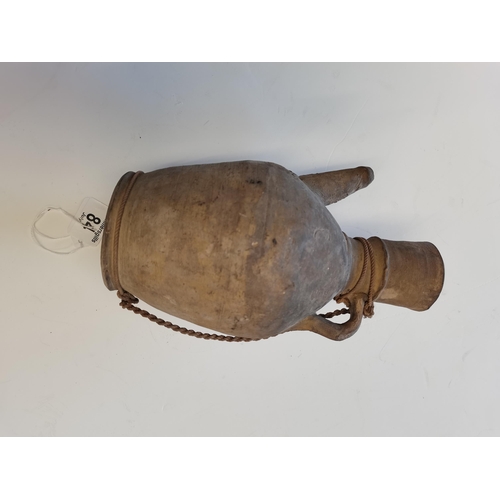 84 - A Chinese Tang dynasty water vessel with attached string 26cm high