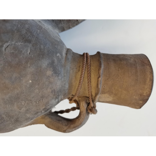 84 - A Chinese Tang dynasty water vessel with attached string 26cm high