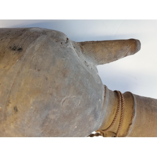 84 - A Chinese Tang dynasty water vessel with attached string 26cm high