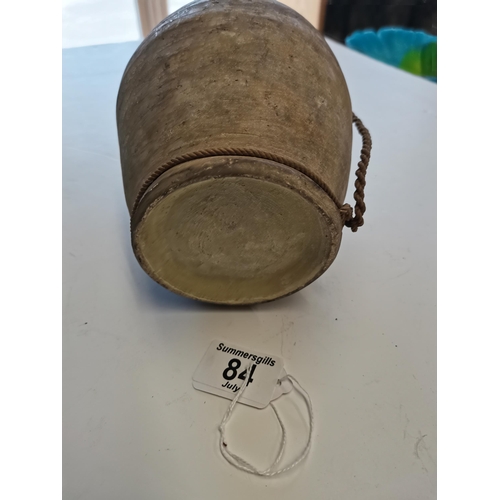 84 - A Chinese Tang dynasty water vessel with attached string 26cm high
