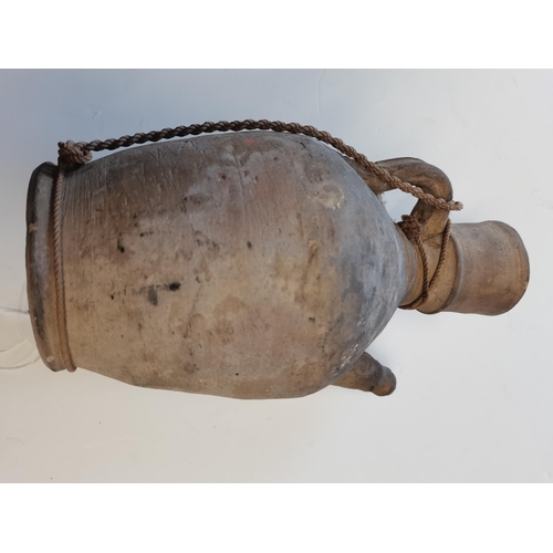 84 - A Chinese Tang dynasty water vessel with attached string 26cm high