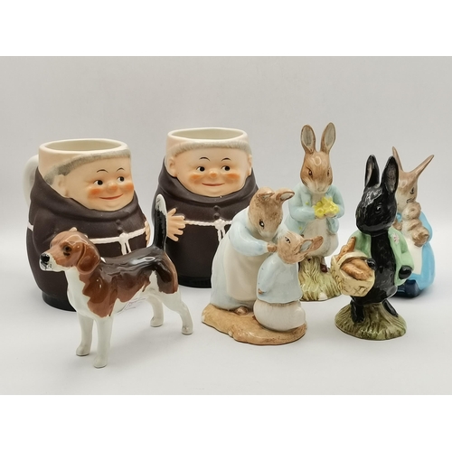 87 - A group of collectable ceramic figures, comprising a Beswick hound, 'Ch. Wendover Billy'; four Royal... 