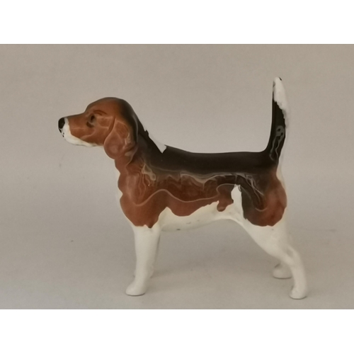 87 - A group of collectable ceramic figures, comprising a Beswick hound, 'Ch. Wendover Billy'; four Royal... 