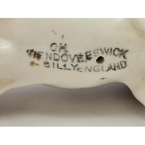 87 - A group of collectable ceramic figures, comprising a Beswick hound, 'Ch. Wendover Billy'; four Royal... 