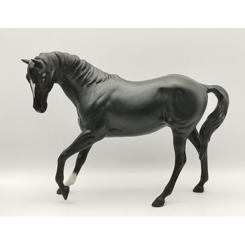 88 - A collection of Beswick animal figures, comprising Angus cow and bull, black gloss, gold backstamp a... 