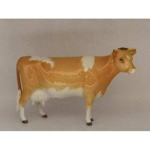 88 - A collection of Beswick animal figures, comprising Angus cow and bull, black gloss, gold backstamp a... 